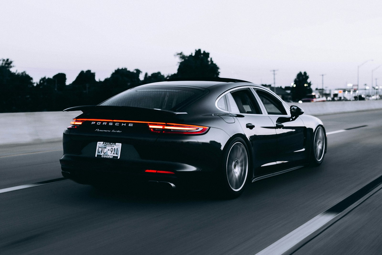 Cinematic view of a black luxury sedan in motion